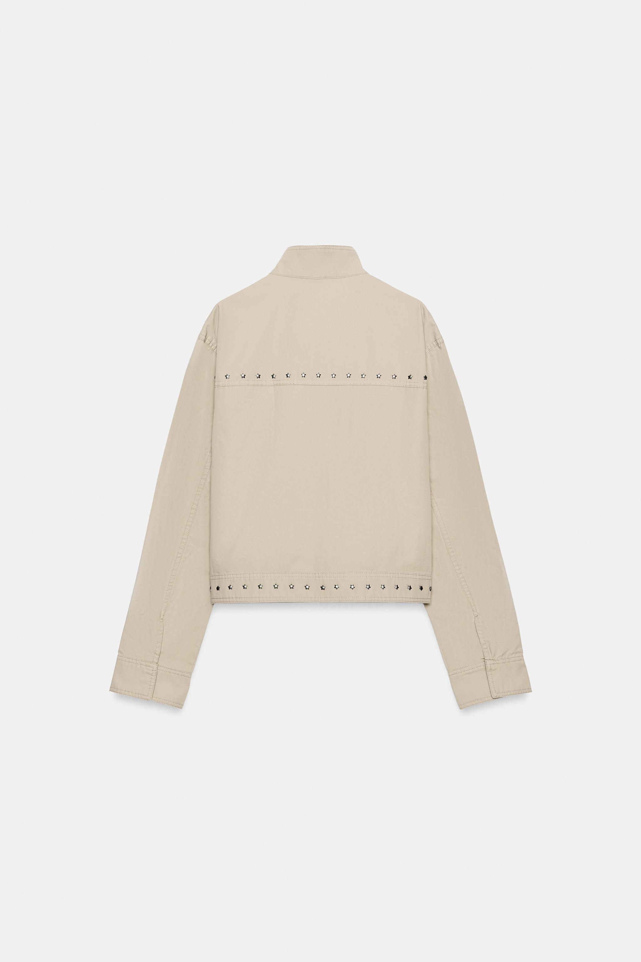 VESTE EFFET DÉLAVÉ À CLOUS